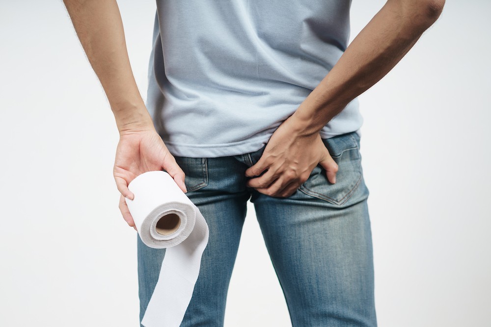 young-man-holding-his-bottom-tissue-paper-because-diarrhea-hemorrhoids-constipation-health-care-medical-concept.jpg