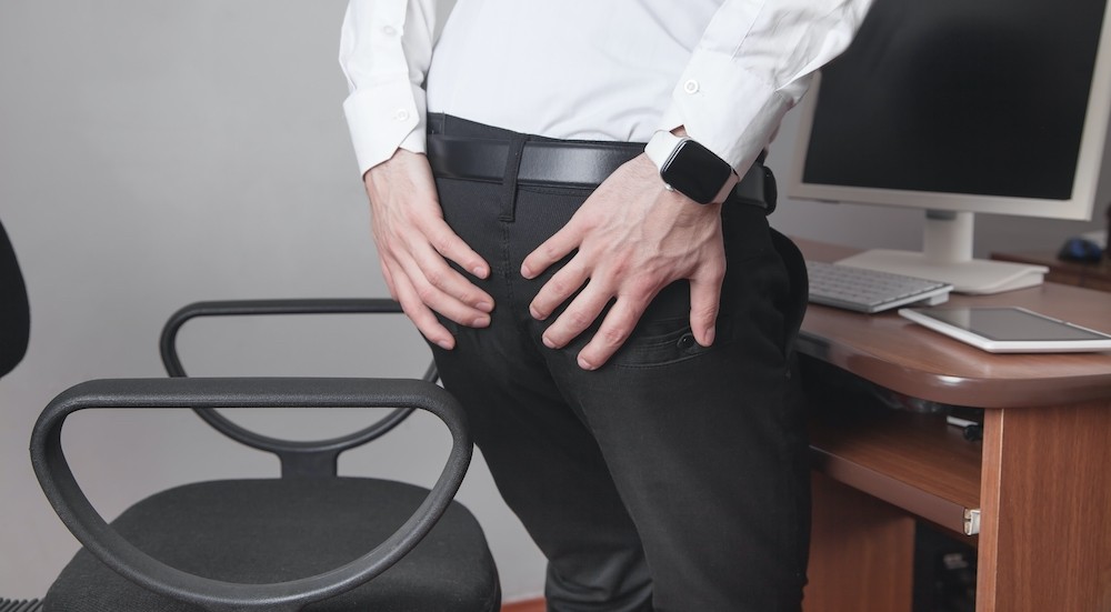 caucasian-businessman-suffering-from-hemorrhoids-office.jpg